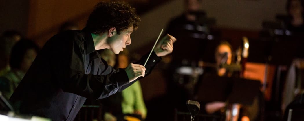 Composer Matthew Aucoin conducting at Peabody Essex Museum. (John Andrews/Peabody Essex Museum)