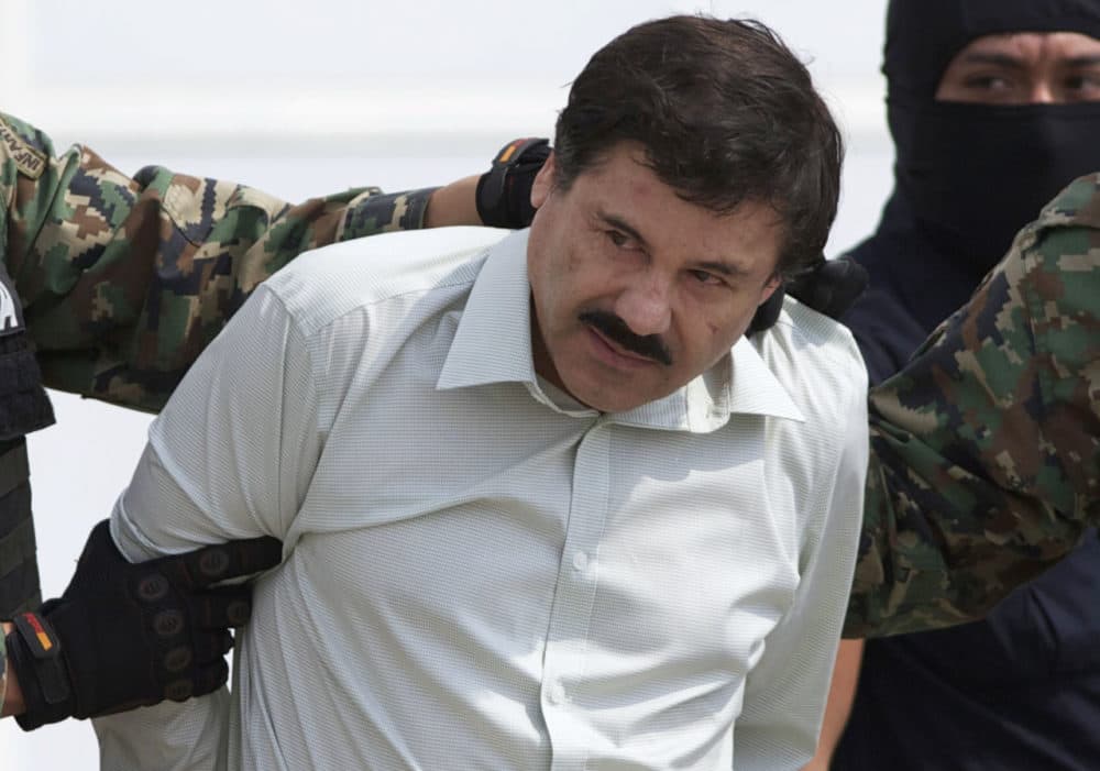In this 2014 file photo, Joaquin "El Chapo" Guzman, head of Mexico’s Sinaloa Cartel, is escorted to a helicopter in Mexico City, following his capture in the beach resort town of Mazatlan in February that year. (Eduardo Verdugo/AP)