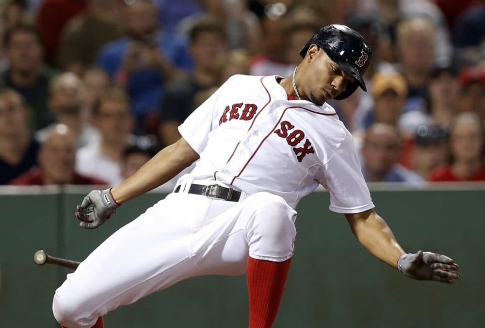 Boston Red Sox's Xander Bogaerts dodges an inside pitch during the seventh inning. (AP Photo/Michael Dwyer)