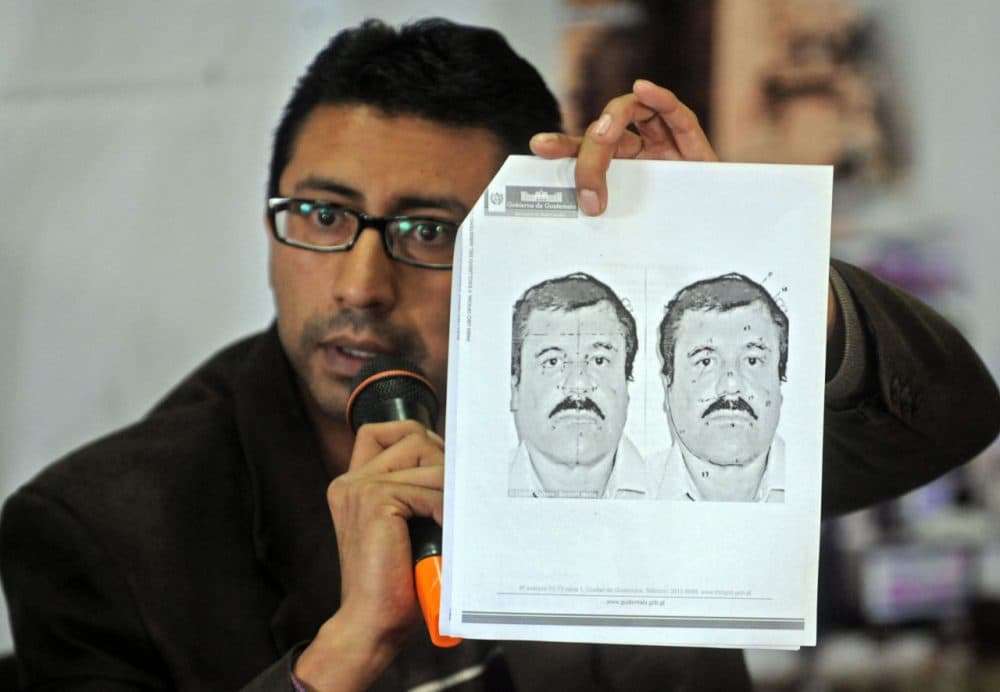 Guatemalan migration director Carlos Pac shows a picture of Mexican drug trafficker Joaquin "El Chapo" Guzman Loera during a press conference in Guatemala City on July 12, 2015. The security authorities of Guatemala are in alert after the escape of the leader of the powerful Sinaloa cartel, reported Sunday an official source. AFP PHOTO / Johan ORDONEZ (Photo credit should read JOHAN ORDONEZ/AFP/Getty Images)