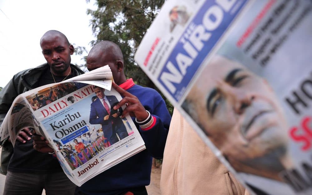 People read local newspapers with pictures of US President Barack Obama and with headlines "Welcome Obama" on July 24, 2015 in Nairobi. (SIMON MAINA/AFP/Getty Images)