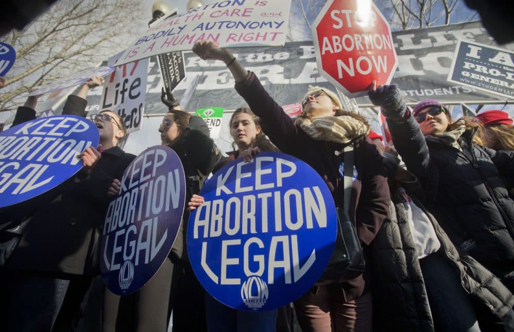 Pro-life and anti-abortion demonstrators converge in front of the Supreme Court in Washington Jan. 22, 2015. (Pablo Martinez Monsivais/AP)