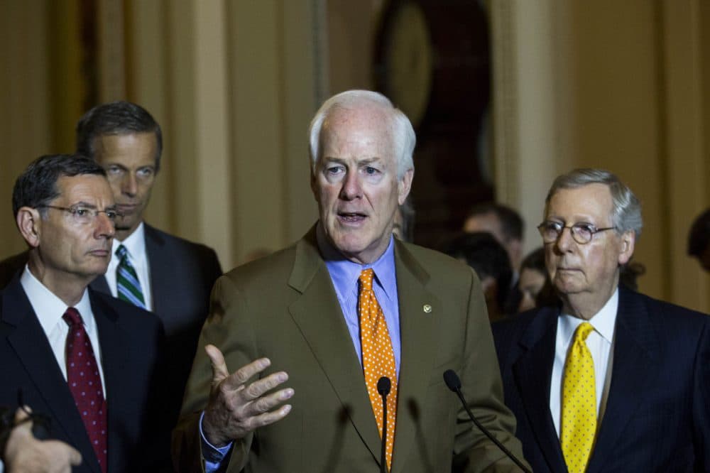 From left, Sen. John Barrasso (R-WY), Sen. John Thune (R-SD), Sen. John Cornyn (R-TX) and Senate Majority Leader Mitch McConnell (R-KY) take questions during a news conference after a meeting with Senate Republicans, on Capitol Hill, July 28, 2015 in Washington, DC. On Tuesday, the Senate is continuing to work toward passing a long-term extension of a federal highway bill that is set to expire on Friday. (Drew Angerer/Getty Images)