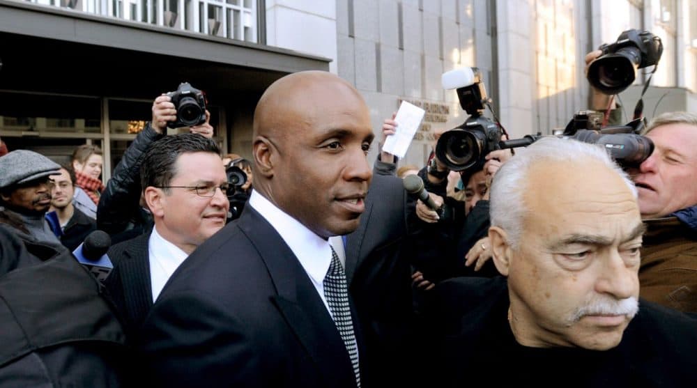 Former baseball player Barry Bonds leaves federal court after being sentenced for obstructing justice in a government steroids investigation in, Dec. 2011, in San Francisco. (AP Photo/Noah Berger)