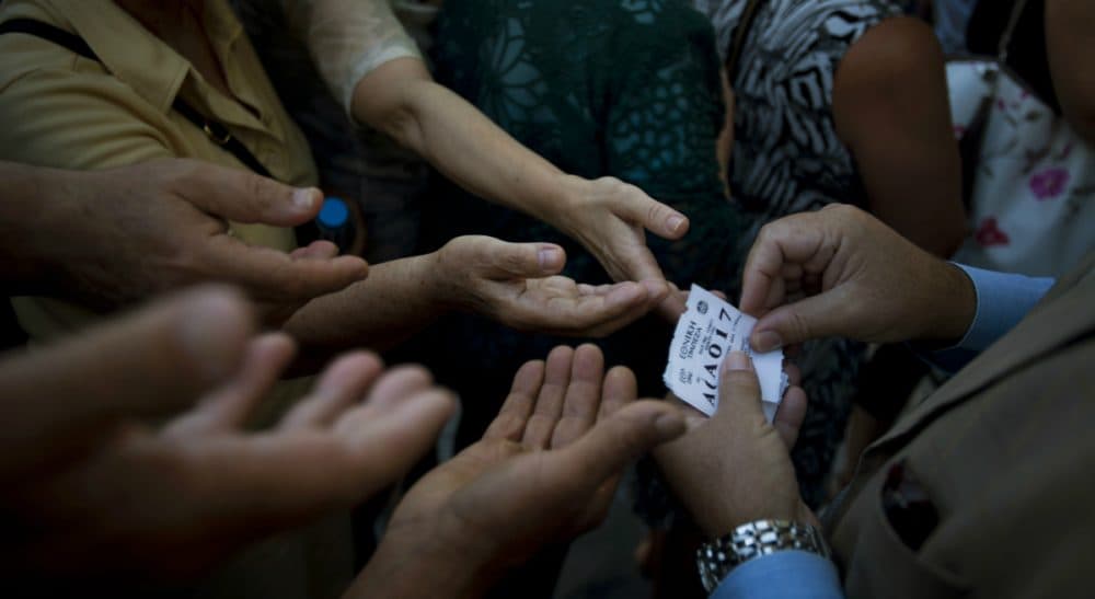 Rich Barlow: "Might Europe’s financial sickness leapfrog the Atlantic and thud on our own fragile recovery?" Pictured: A bank employee distributes tag queue positions to elderly people to enter into the bank to withdraw a maximum of 120 euros ($134) for the week in central Athens, Monday, July 13, 2015. A Eurozone summit has reached a tentative agreement with Athens on a bailout program that includes “serious reforms” and aid, removing an immediate threat of financial collapse in Greece. (Emilio Morenatti/AP)
