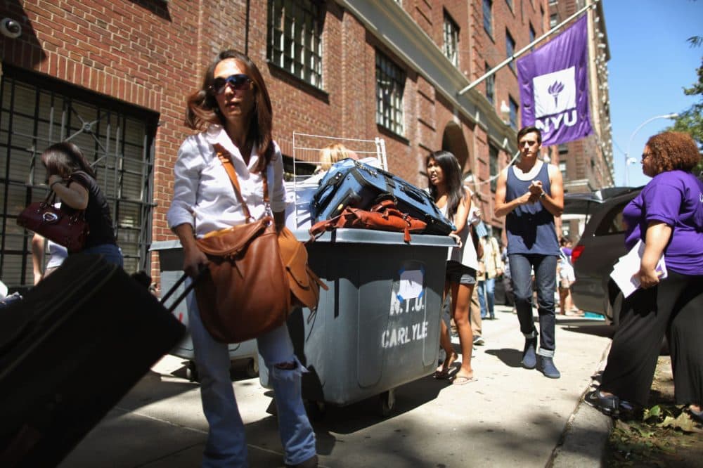 New York University freshmen students and their families fill rolling bins with their belongings as they move into their dorm rooms outside Hayden Hall August 29, 2011 in New York City. (Chip Somodevilla/Getty Images)
