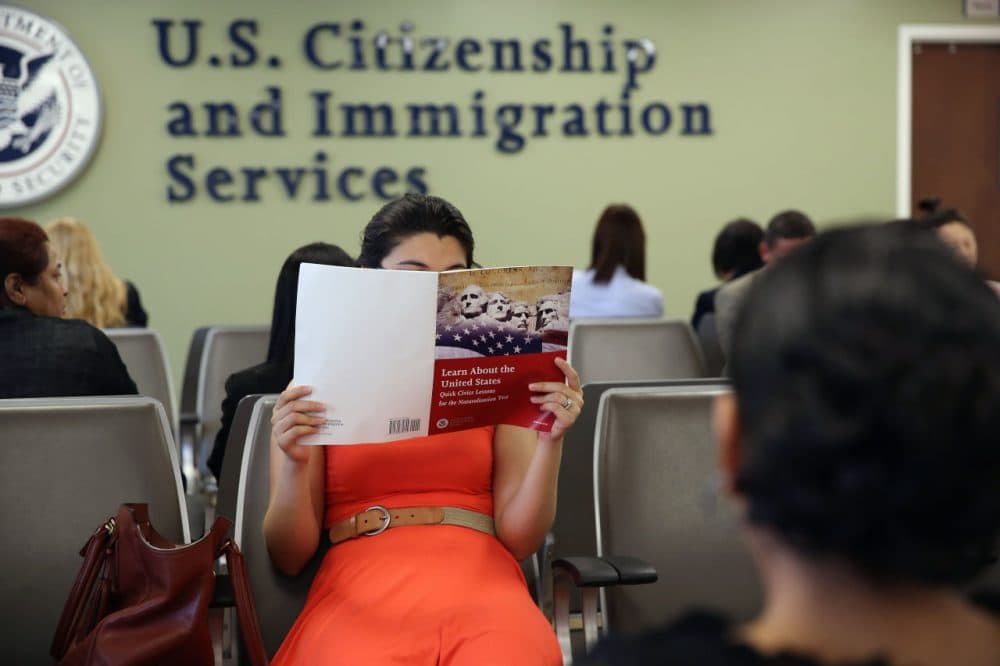 A Colombian immigrant studies ahead of her citizenship exam at the U.S. Citizenship and Immigration Services (USCIS) Queens office on May 30, 2013 in the Long Island City neighborhood of the Queens borough of New York City. (John Moore/Getty Images)