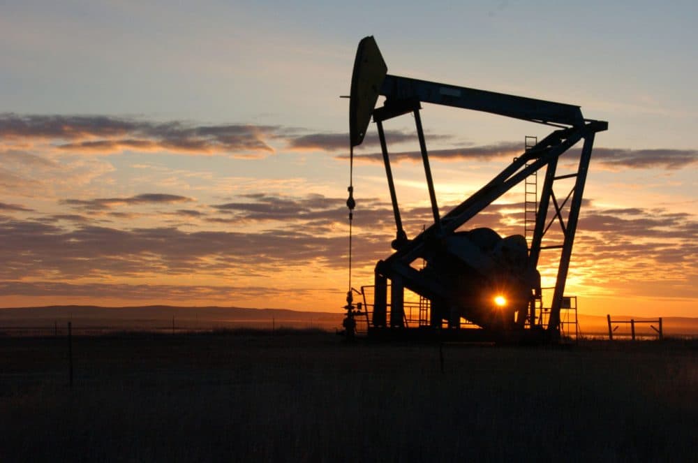 A Whiting Petroleum Co. pump jack pulls crude oil from the Bakken region of the Northern Plains near Bainville, Mont., Nov. 6, 2013. (Matthew Brown/AP)