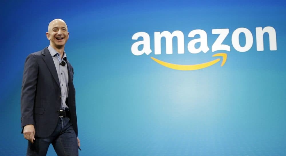 In this June 16, 2014, file photo, Amazon CEO Jeff Bezos walks onstage for the launch of the new Amazon Fire Phone, in Seattle. A New York Times article portrayed Amazon’s work culture as “bruising” and “Darwinian” in part because of the way it uses data to manage its staff. Amazon’s CEO said in a memo to staff on Monday, Aug. 17, 2015, that the article doesn’t accurately describe the company culture he knows. (Ted S. Warren/ AP)