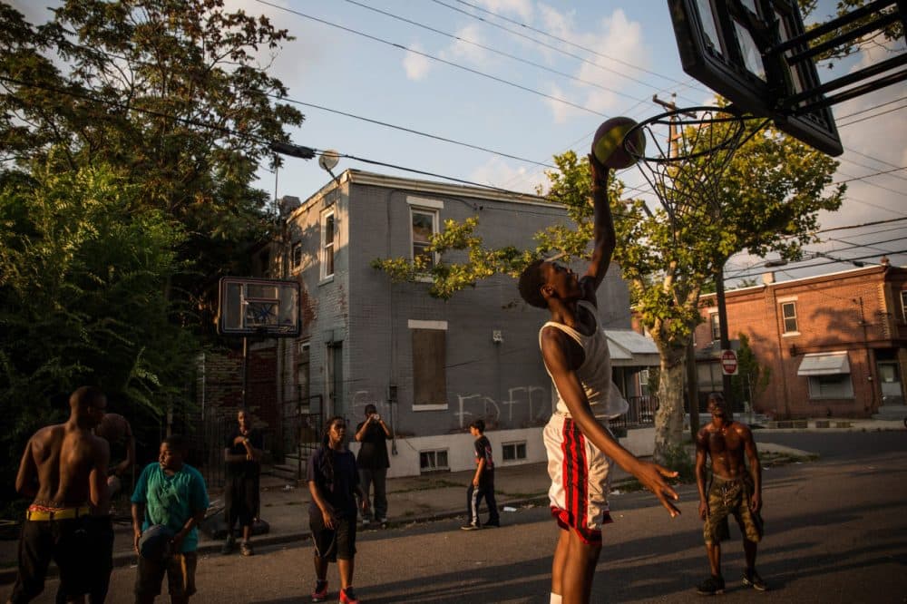 Is dunking a basketball more difficult than scoring a hole-in-one or landing a flip on a balance beam? (Andrew Burton/Getty Images)