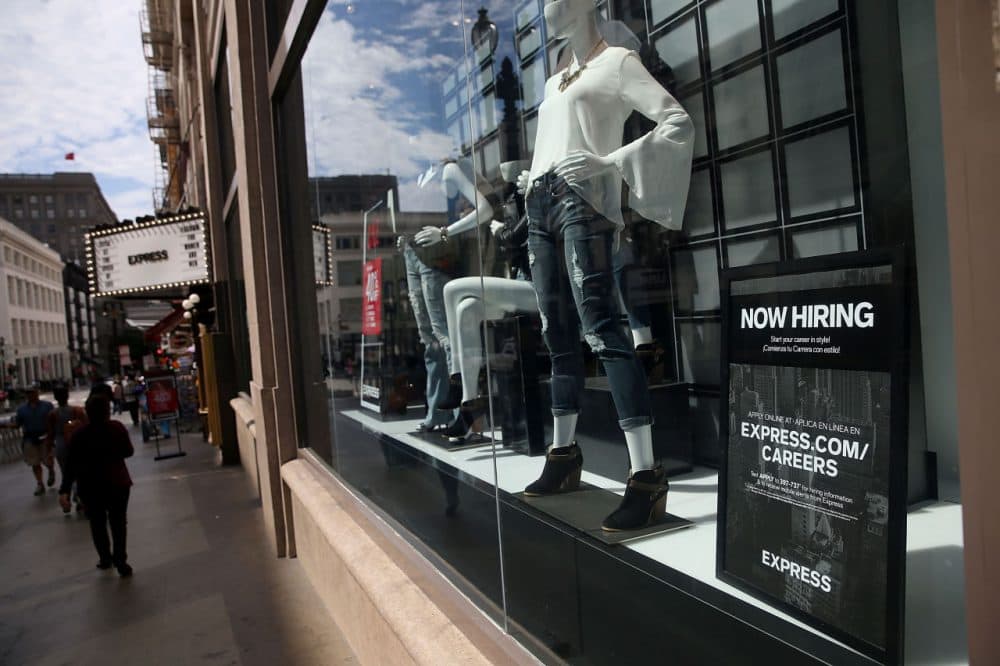 A "now hiring" sign is posted in the window of an Express clothing store on July 2, 2015 in San Francisco, California. According to a report by the U.S. Labor Department, employers added 223,000 jobs in June dropping the national unemployment rate to 5.3 percent, the lowest level since April 2008. (Justin Sullivan/Getty Images)