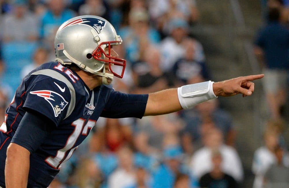 Tom Brady #12 of the New England Patriots reads the Carolina Panthers defense in the 1st quarter during their preseason NFL game at Bank of America Stadium on August 28, 2015 in Charlotte, North Carolina. (Grant Halverson/Getty Images)