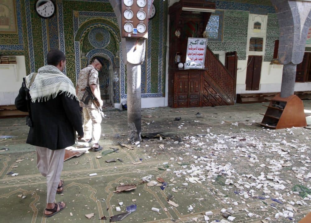 A Yemeni Huthi rebel checks the Balili mosque in the capital Sanaa, following an explosion on on the first day of Eid al-Adha. (Mohammed Huwais/Getty Images)