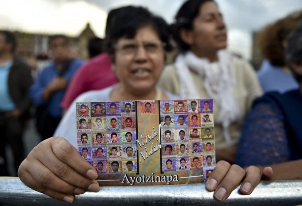 People gathering in Mexico City show their support to parents, relatives and friends of the 43 missing students from a rural teachers college from Ayotzinapa. (Yuri Cortez/AFP/Getty Images)