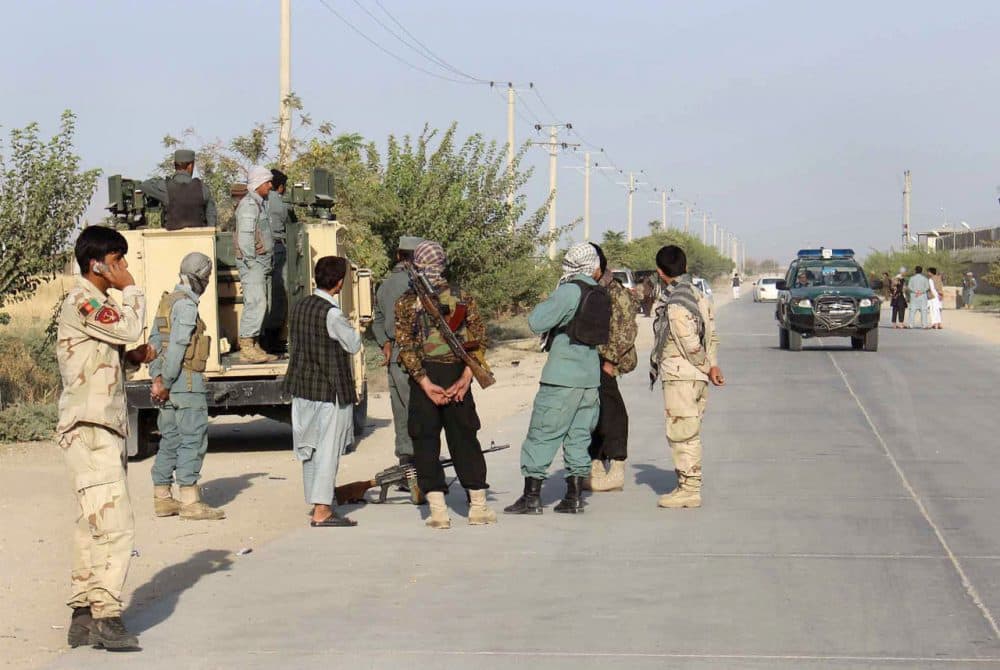 Afghan security forces gather at the roadside a day after Taliban insurgents overran the strategic northern city of Kunduz, on September 29, 2015. Afghanistan on September 29, 2015, mobilized reinforcements for a counter-offensive to take back Kunduz, a day after Taliban insurgents overran the strategic northern city in their biggest victory since being ousted from power in 2001. (STR/AFP/Getty Images)