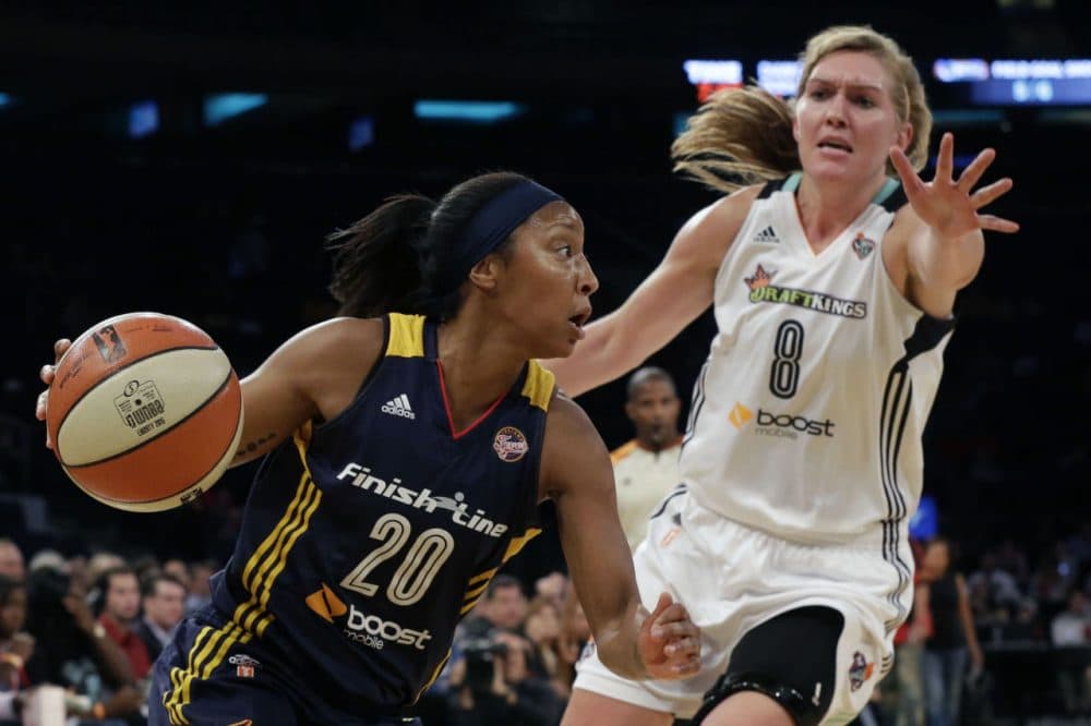 Indiana Fever guard Briann January (20) drives to the basket past New York Liberty center Carolyn Swords (8) during Game 1 of the WNBA basketball Eastern Conference finals on Sept. 23, 2015 at Madison Square Garden in New York. (Mary Altaffer/AP)