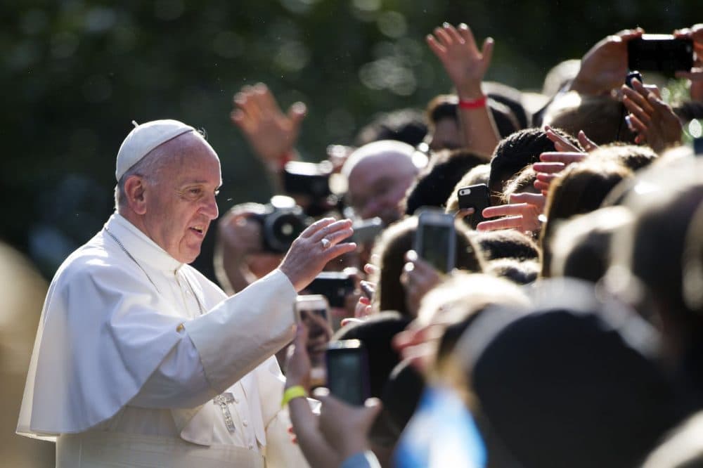 Pope Francis greets school children before he departs the Apostolic Nunciature, the Vatican's diplomatic mission in the heart of Washington, en route to the Capitol to address a joint meeting of Congress Thursday, Sept. 24, 2015. (Cliff Owen/AP)