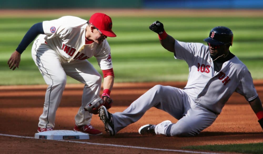 David Ortiz, right, is tagged out by Cleveland Indians Giovanny Urshela while attempting to steal third base during the first inning of a baseball game, Sunday, Oct. 4, 2015, in Cleveland. The Red Sox lost the game 3-1. (Ron Schwane/AP)