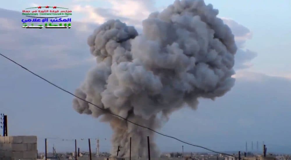 This image taken from video provided by the Syrian activist-based media group Syrian Revolutionary Command Council in Hama, which has been verified and is consistent with other AP reporting, shows smoke rising after a Russian airstrike hit buildings in the town of Latamna in the area of Hama in Eastern Syria, Wednesday, Oct. 7, 2015. (Syrian Revolutionary Command Council in Hama via AP Video)