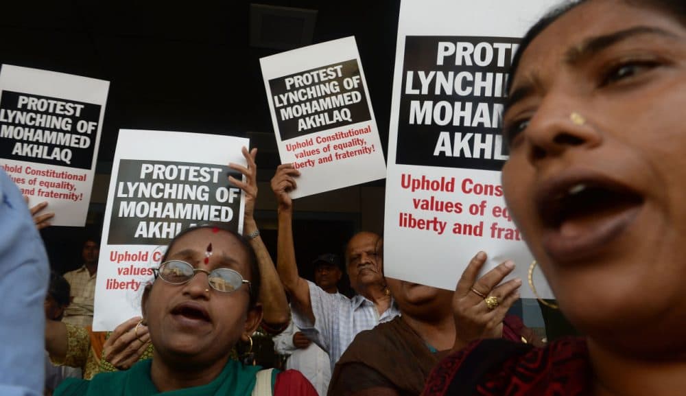 Indian protesters shout slogans during a demonstration to condemn the lynching and murder of an Indian Muslim, in Mumbai on October 6, 2015. Mohammad Akhlaq, 50, was dragged from his house September 29, 2015 on the outskirts of the capital New Delhi and attacked by a Hindu mob over rumors that he had stored and eaten beef. (Indranil Mukherjee/AFP/Getty Images)