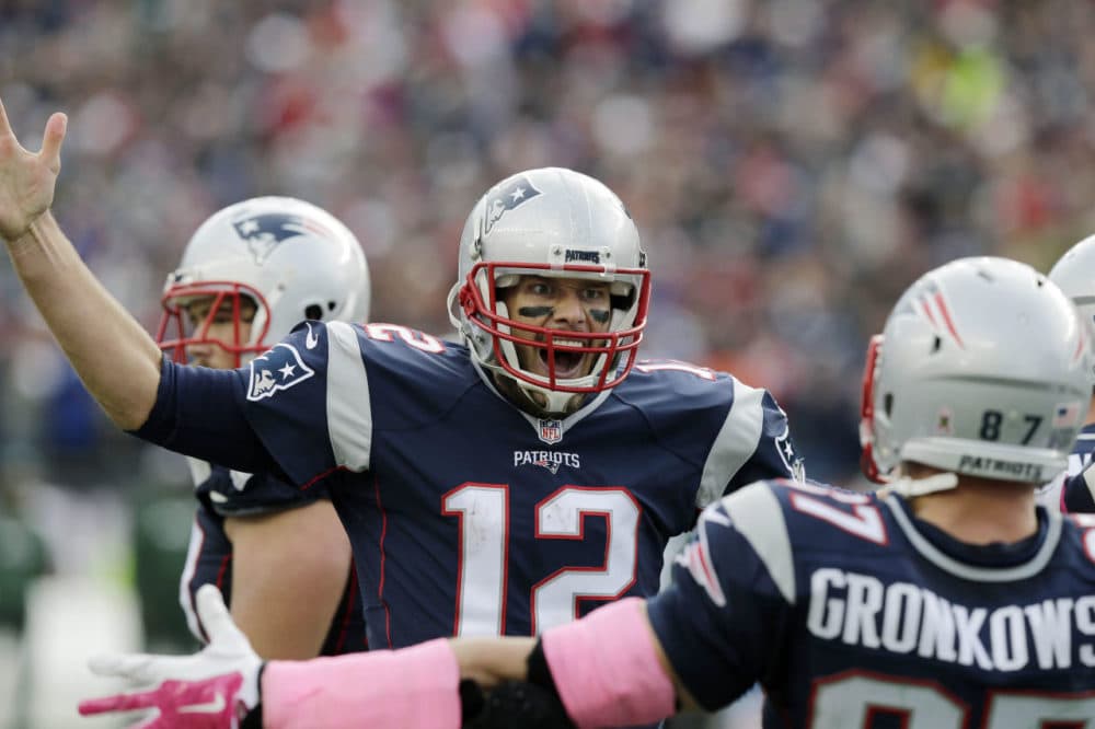 New England Patriots quarterback Tom Brady (12) celebrates his touchdown pass to tight end Rob Gronkowski (87) during the second half of an NFL football game, Sunday, in Foxborough, Mass. (Charles Krupa/AP)