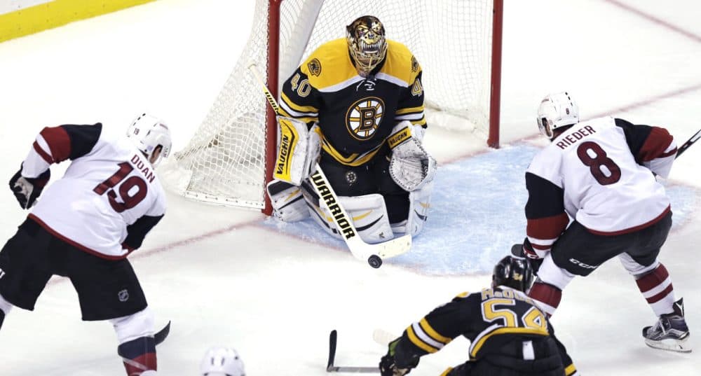 Boston Bruins goalie Tuukka Rask (40) makes a save as Arizona Coyotes right wing Shane Doan (19) and center Tobias Rieder (8) look for the rebound during the third period of the game at the TD Garden yesterday. (Charles Krupa/AP)