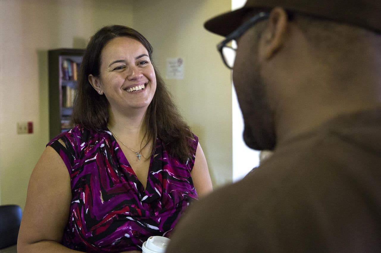Annissa Essaibi George speaks with Kevin Poindexter, 52, during a campaign stop in Dorchester on Thursday. (Robin Lubbock/WBUR)