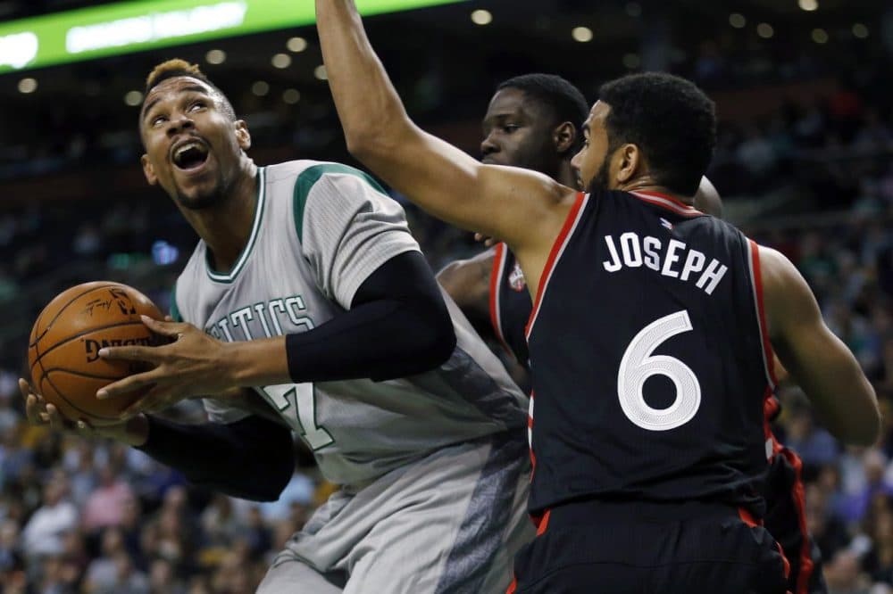 Toronto Raptors' Anthony Bennett, behind, and Cory Joseph (6) double-team Boston Celtics' Jared Sullinger (7) during Friday night's game in Boston. (Michael Dwyer/AP)