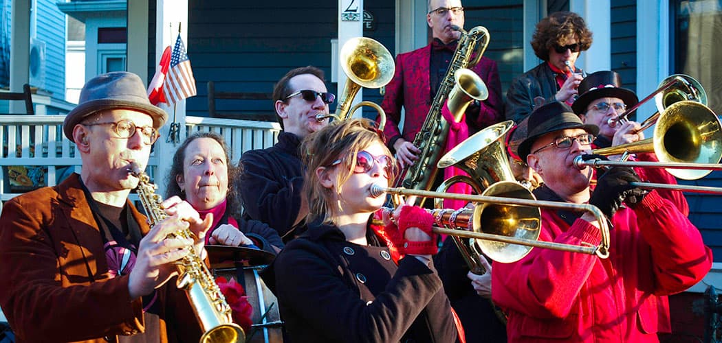 Trudi Cohen (second from left) plays bass drum with the Second Line Social Aid and Pleasure Society Brass Band. (Jesse Edsell-Vetter)