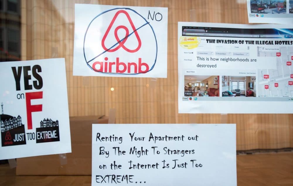 Signs showing support for Proposition F are posted on a shop window in San Francisco, California on November 2, 2015. The measure failed. (Josh Edelson/AFP/Getty Images)