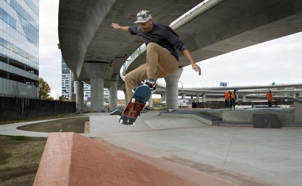Former pro skater and lead designer of the Lynch Family Skate Park, Kanten Russell gets some air at the Lynch Family Skate Park. (Robin Lubbock/WBUR)