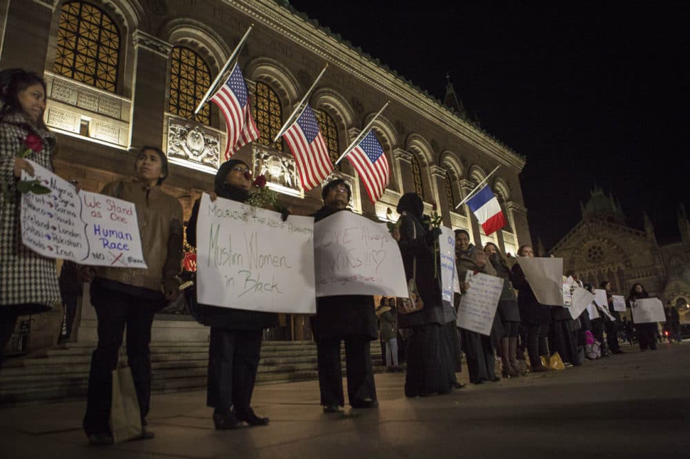 A group of about two dozen Muslim women gathered outside the Boston Public Library in Copley Square to mourn the victims in Paris in what they called a "silent vigil." (Jesse Costa/WBUR)