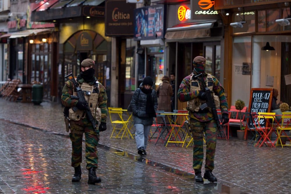 Armed policemen patrol along Rue Du Marche Aux Poulets on November 24, 2015 in Brussels, Belgium. At a press conference last night the Belgian Prime Minister Charles Michel announced that the city would remain at terror alert level four which is the countries highest threat level. The Prime Minister also announced that the public transport system and schools would re-open Wednesday. (Ben Pruchnie/Getty Images)