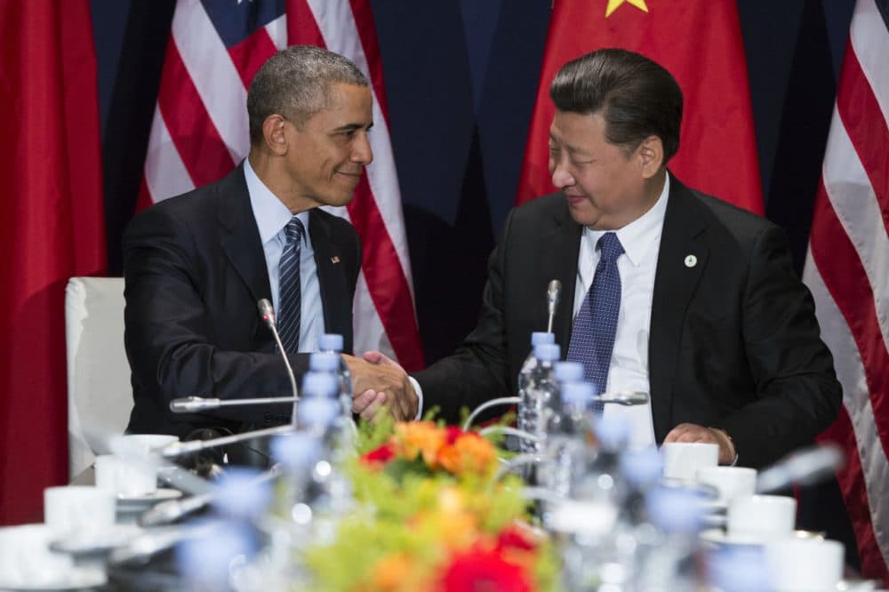 U.S. President Barack Obama, left, shakes hands with Chinese President Xi Jinping during their meeting held on the sidelines of the COP21, United Nations Climate Change Conference, in Le Bourget, outside Paris, Monday, Nov. 30, 2015. (Evan Vucci/AP Photo)