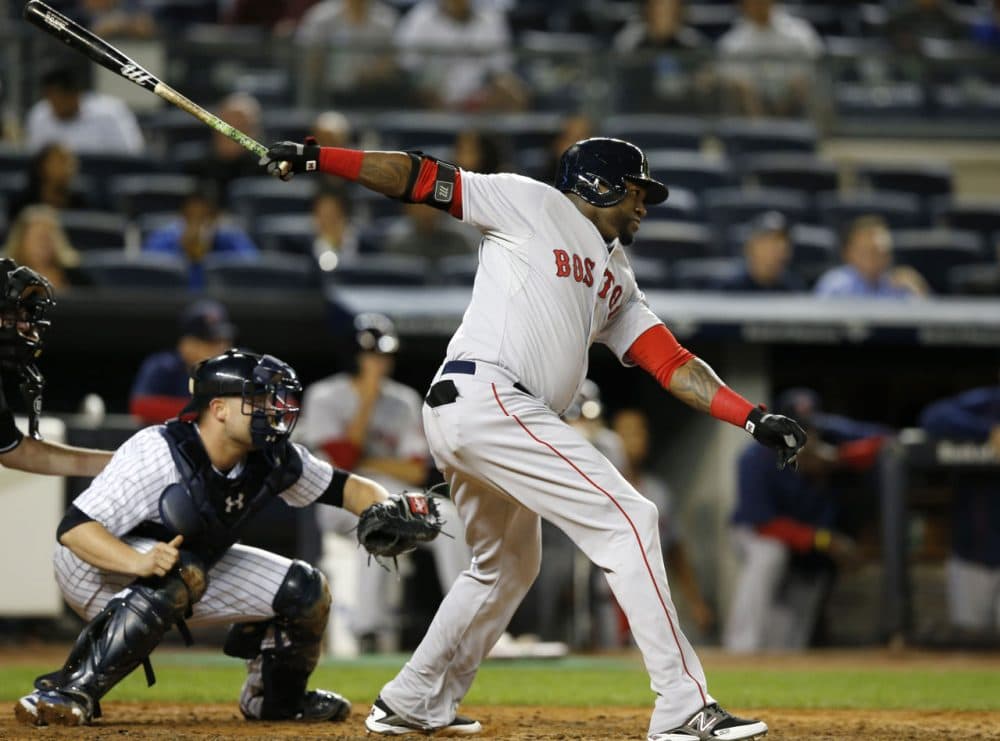 Boston Red Sox designated hitter David Ortiz hits a third-inning, RBI single in a baseball game against the New York Yankees in New York, Wednesday, Sept. 30, 2015. (AP Photo/Kathy Willens)