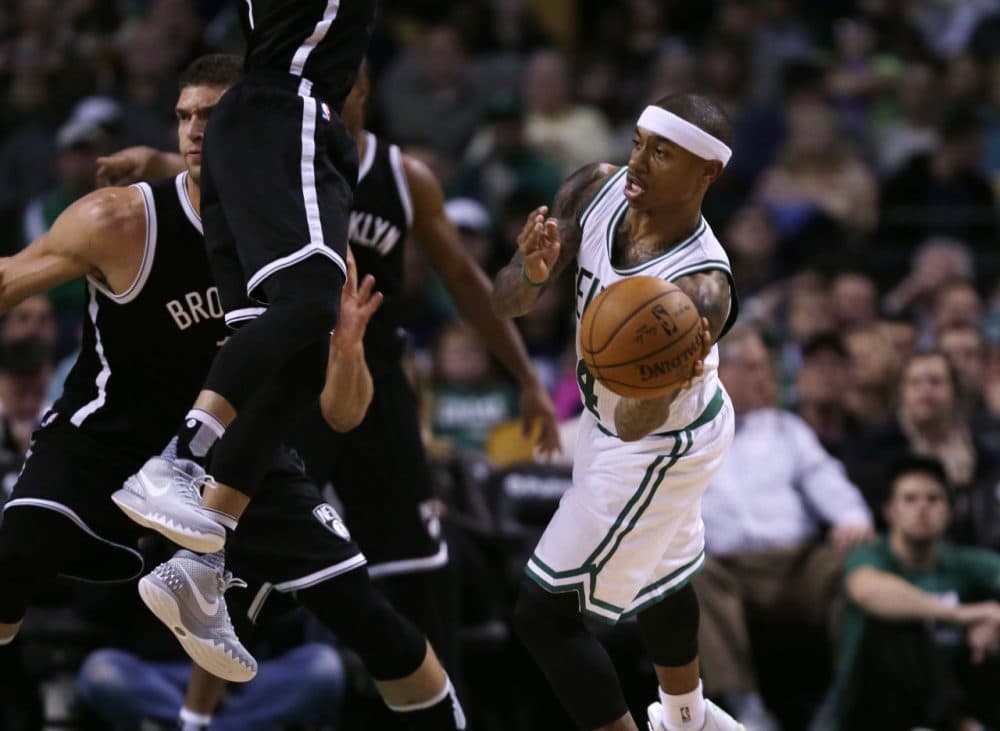 Boston Celtics guard Isaiah Thomas (4) passes during Friday night's game in Boston. (Charles Krupa/AP)