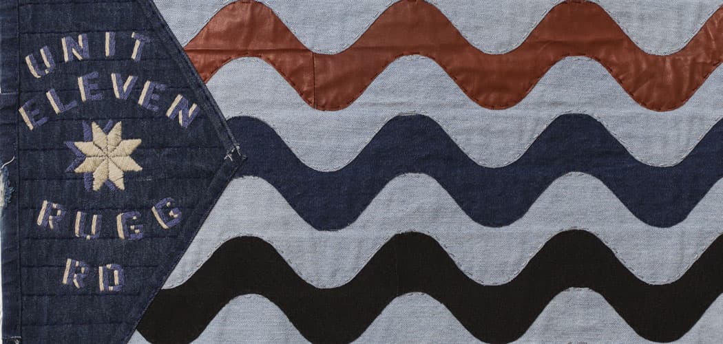 Unit Eleven, a warehouse on Rugg Road, is recalled in Melanie Bernier's flag, with stripes, evoking the streak of blue paint that once adorned its walls. (Courtesy)