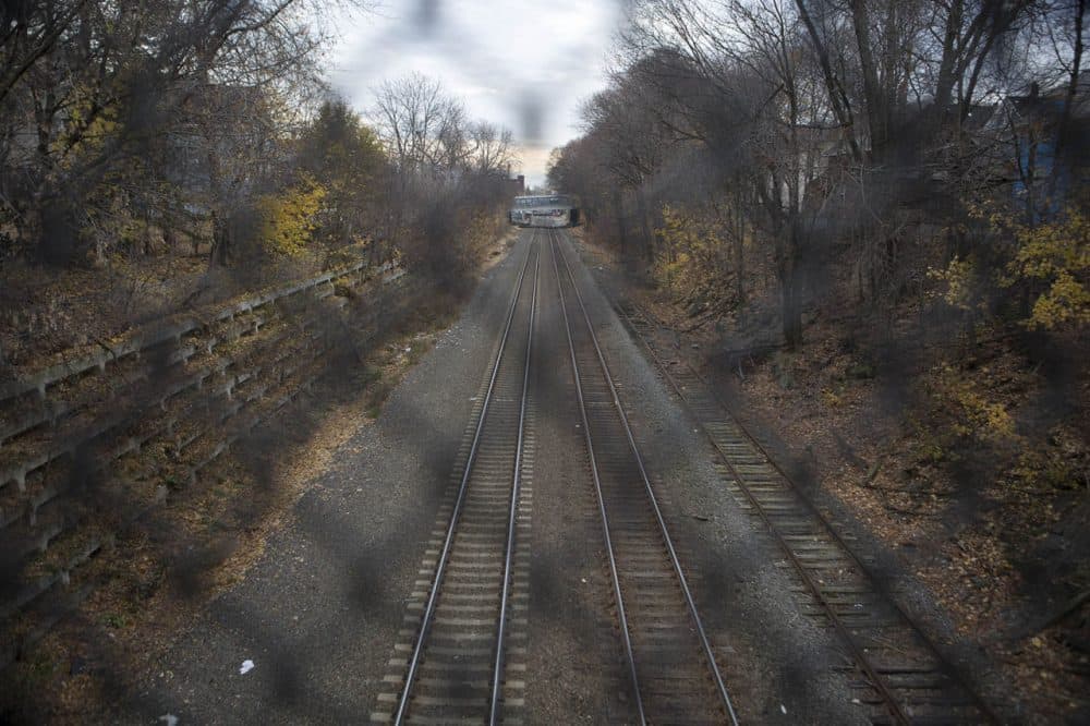 The tracks along the corridor for the proposed Green Line extension to Somerville and Medford already serve commuter rail and Amtrak trains. (Jesse Costa/WBUR)