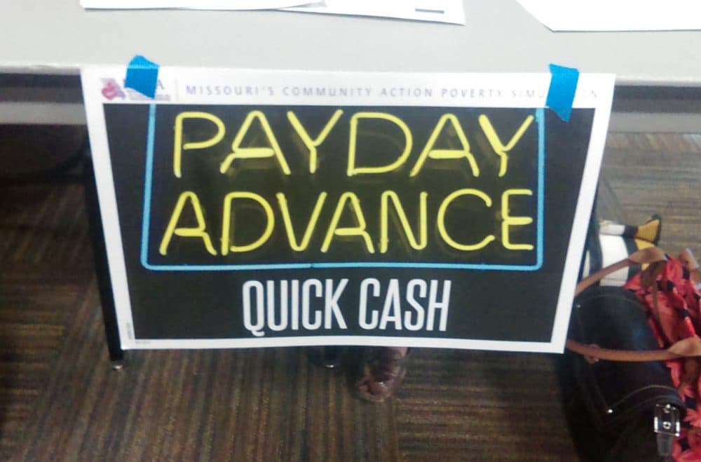The poverty simulation included this "payday advance" table. (Gabrielle Ware/Georgia Public Broadcasting)