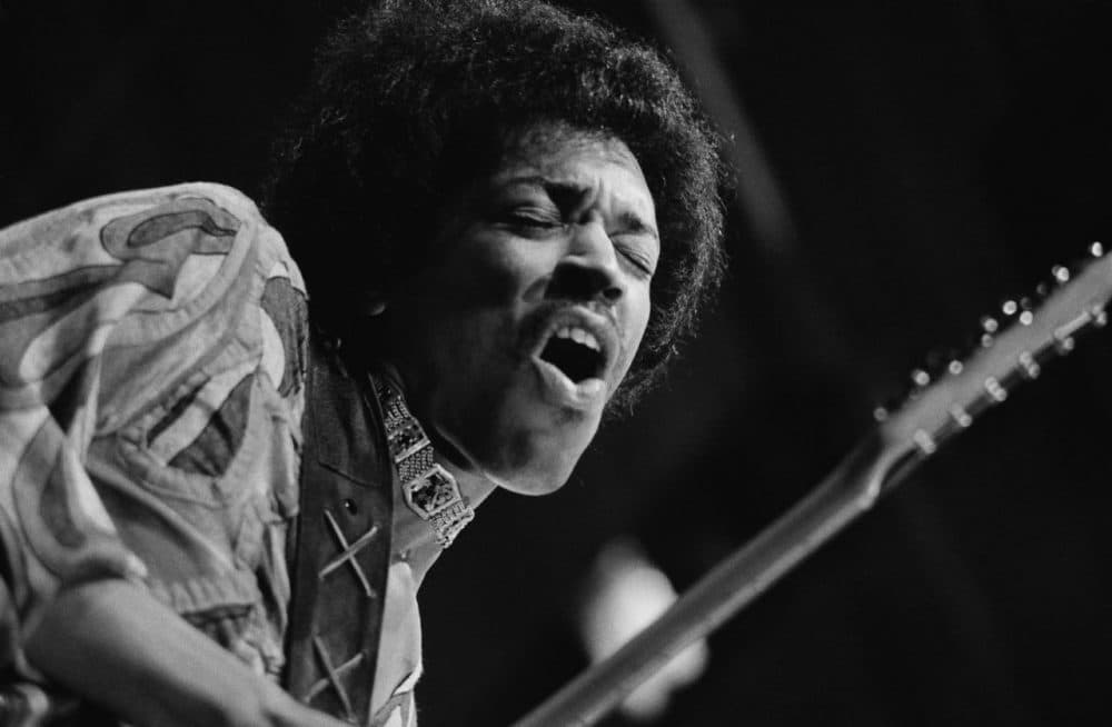 Rock guitar virtuoso Jimi Hendrix (1942 - 1970) caught mid guitar-break during his performance at the Isle of Wight Festival, August 1970. (Evening Standard/Getty Images)