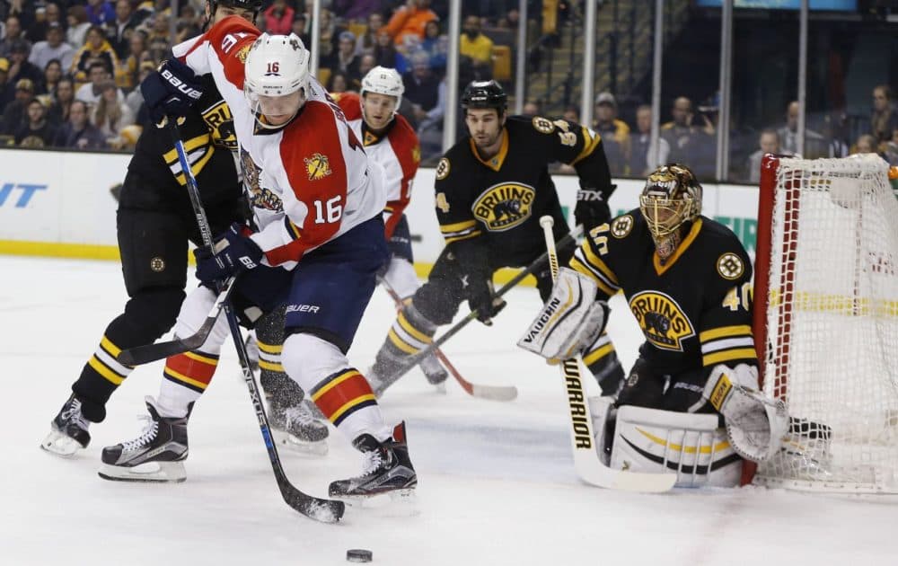 Florida Panthers' Aleksander Barkov (16) tries to get a shot off on Boston Bruins' Tuukka Rask (40) in Boston on Saturday. (AP Photo/Michael Dwyer)