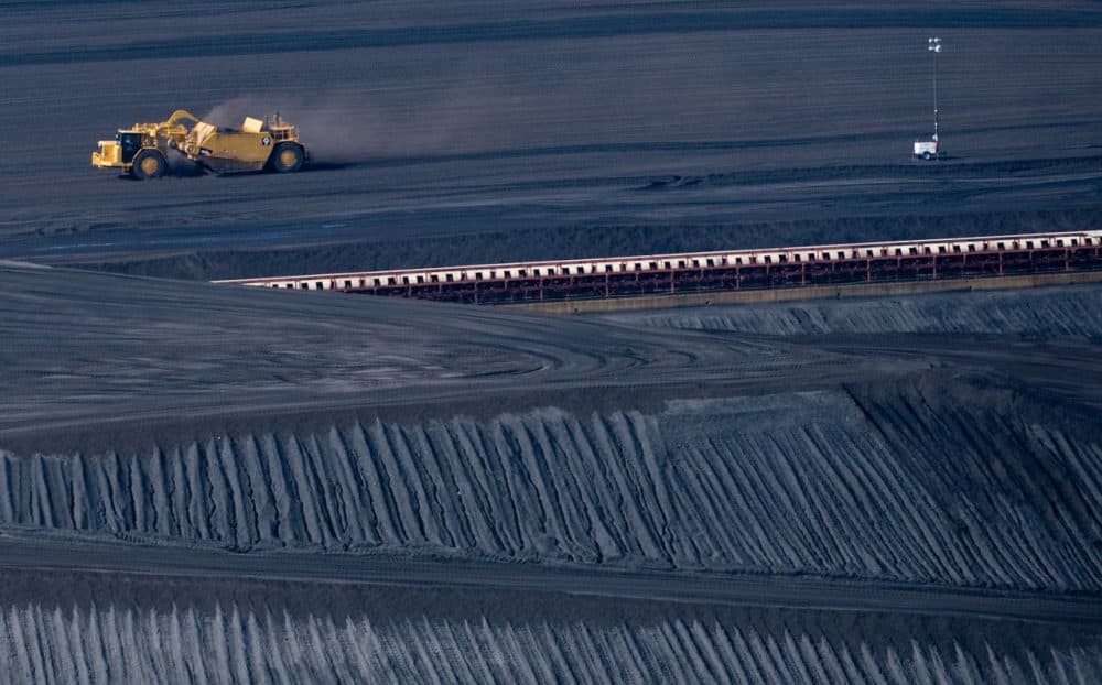 In this file photo, a coal scraper machine works on a pile of coal at American Electric Power's Mountaineer coal power plant in New Haven, West Virginia. (Saul Loeb/Getty Images)
