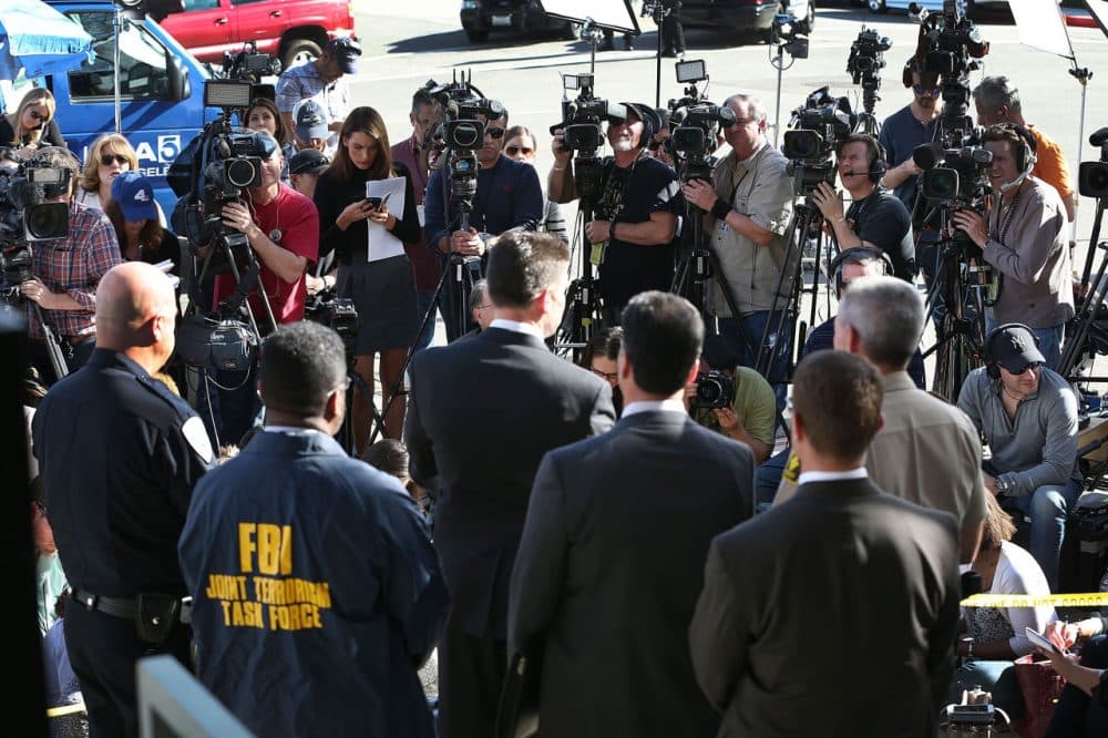 David Bowdich (C), FBI Assistant Director in Charge of the Los Angeles Field Office, stands with other law enforcement officials as he speaks to the media about the terrorist attack at the Inland Regional Center on December 7, 2015 in San Bernardino, California. (Joe Raedle/Getty Images)