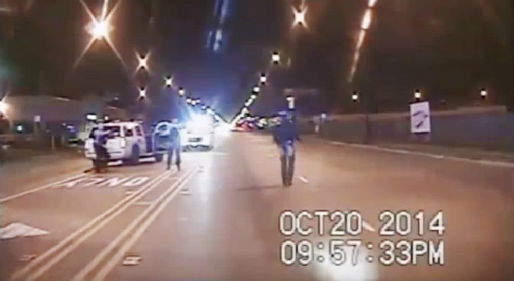 The authors: "It is almost unavoidable to watch a video of a white police officer shooting a black youth but through the lens of our own experiences and backgrounds." Pictured: In this Oct. 20, 2014 frame from dash-cam video provided by the Chicago Police Department, Laquan McDonald, right, walks down the street moments before being shot 16 times by officer Jason Van Dyke in Chicago. (Chicago Police Department via AP)