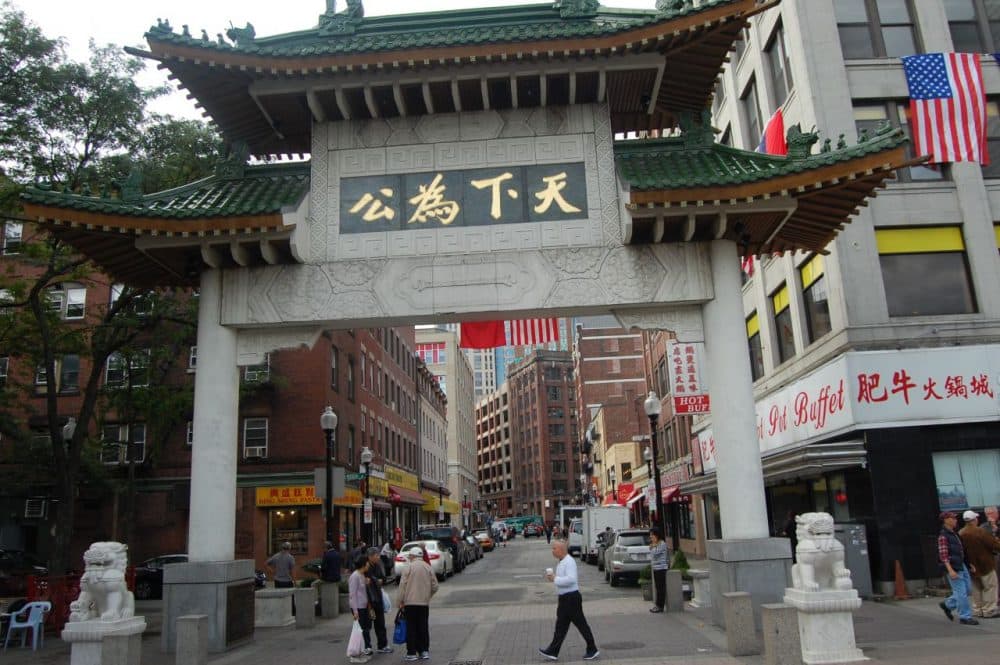Boston's Chinatown has traditionally been an enclave for Chinese immigrants, but rising rents are beginning to push out residents. (WBUR)