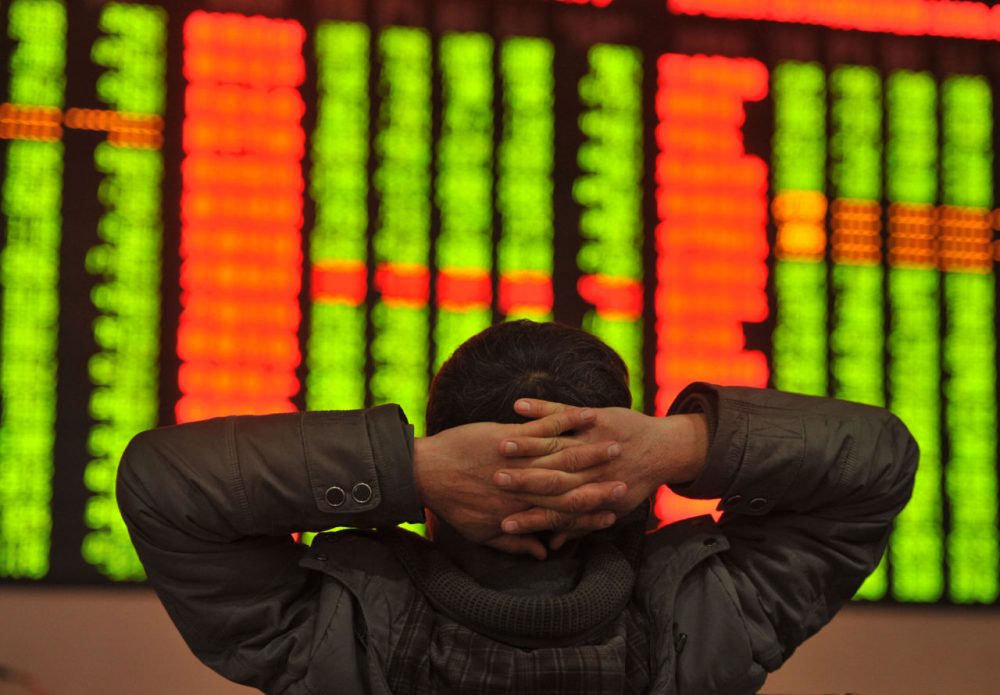 An investor sits in front of a screen showing stock market movements in a stock firm in Fuyang, east China's Anhui province on January 4, 2016. Trading on the Shanghai and Shenzhen stock exchanges was ended early on January 4 after shares fell seven percent, the first time China's new "circuit breaker" intervened to curb market volatility. (STR/AFP/Getty Images)