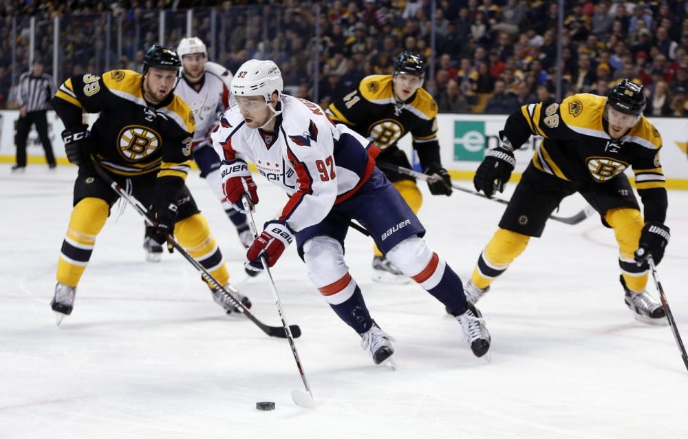 Boston Bruins' Matt Beleskey (39) and Kevan Miller (86) defend against Washington Capitals' Evgeny Kuznetsov (92) during the game last night. The Capitals won 3-2. (Michael Dwyer/AP)