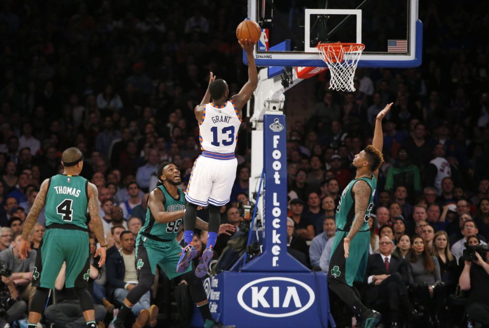 Knicks guard Jerian Grant shoots as Celtics guard Isaiah Thomas, forward Jae Crowder and guard Marcus Smart watch during a game at Madison Square Garden, Tuesday, Jan. 12, 2016. (Kathy Willens/AP)