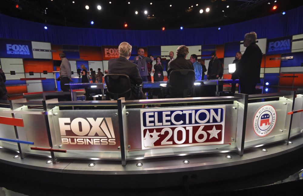 Crew members set the stage at the North Charleston Coliseum, Wednesday, Jan. 13, 2016, in North Charleston, S.C., in advance of Thursday's Fox Business Network Republican presidential debate. (Rainier Ehrhardt/AP)