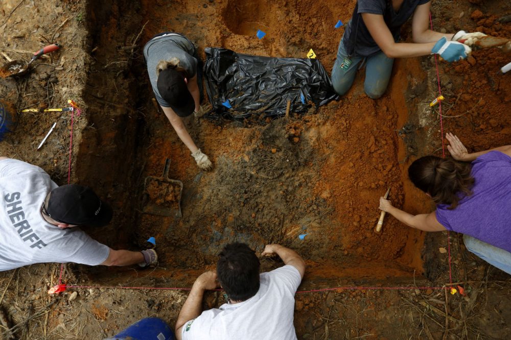 Anthropologists from the University of South Florida exhume gravesites at the Arthur G. Dozier School for Boys in Marianna, Florida, on Sunday, Sept. 1, 2013. Ex-inmates from the 1950s and 1960s detailed horrific beatings at the notorious former reform school. (Edmund D. Fountain/The Tampa Bay Times via AP)